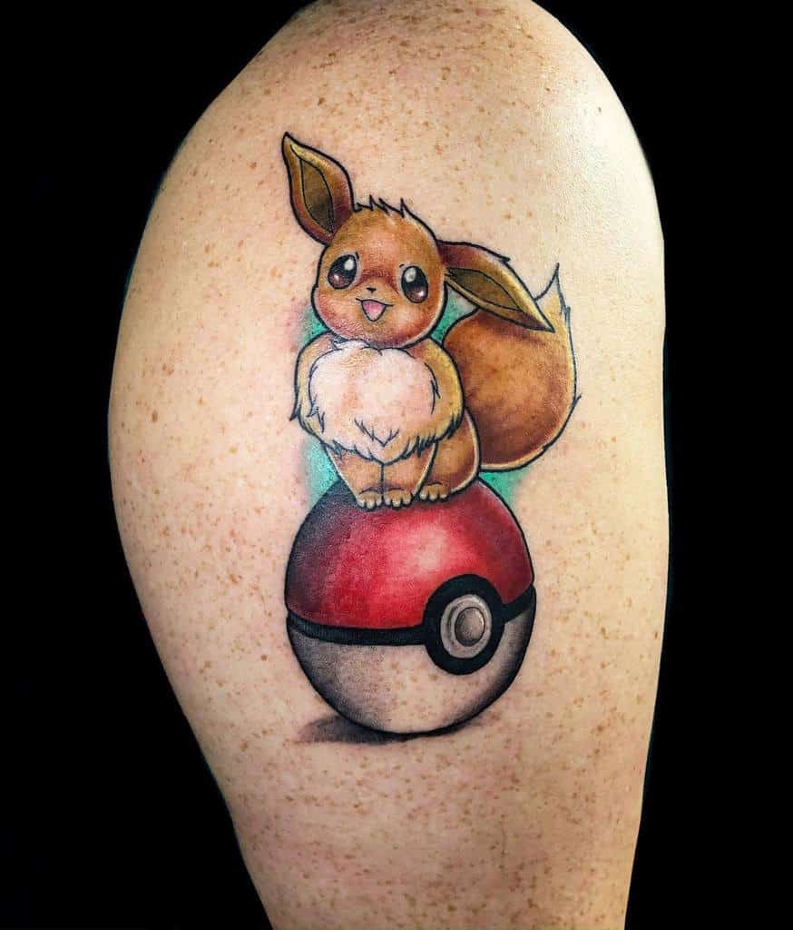 Charming Eevee tattoo sitting on a Pokéball with a soft glow, capturing a playful and adventurous spirit