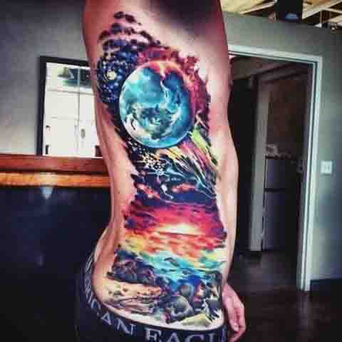 Colorful cosmic and nature tattoo covering side and hip area