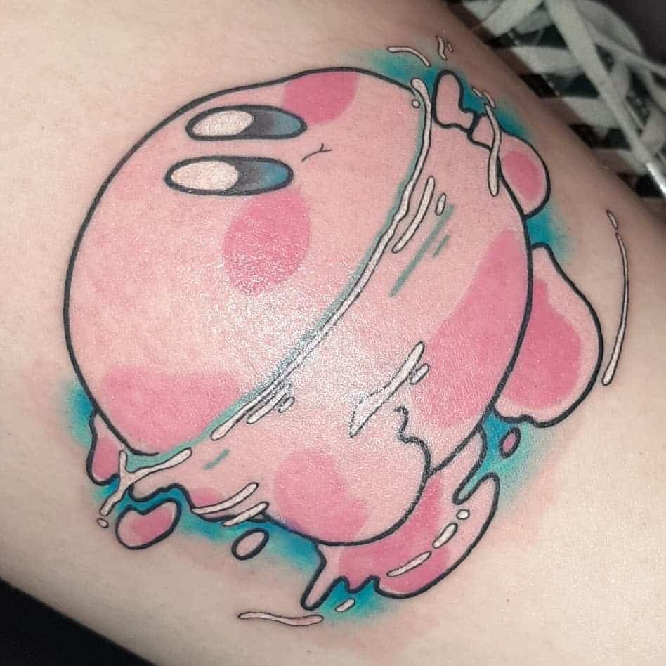 Kirby tattoo appearing to swim or melt, with liquid motion lines and blue highlights, a surreal and dynamic design