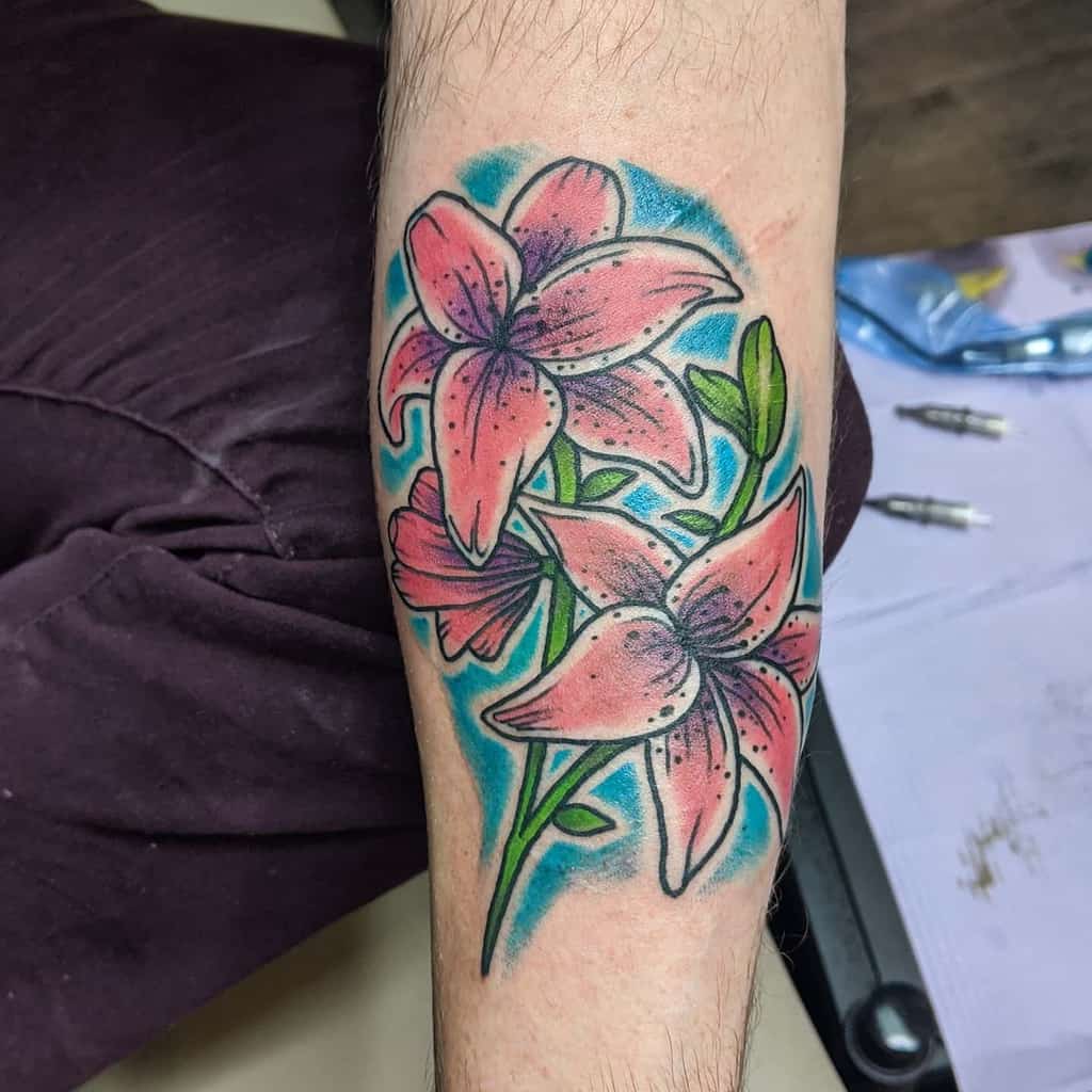 Vibrant tattoo of pink lilies with a bold blue background, blending traditional and neo-traditional styles for a striking floral design