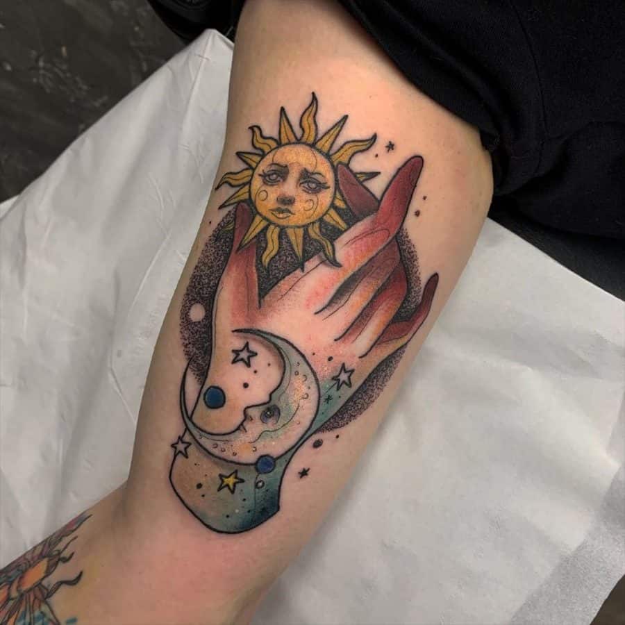 Tattoo of a hand holding a crescent moon with stars, while a radiant sun with a face shines above, blending realism and dotwork.