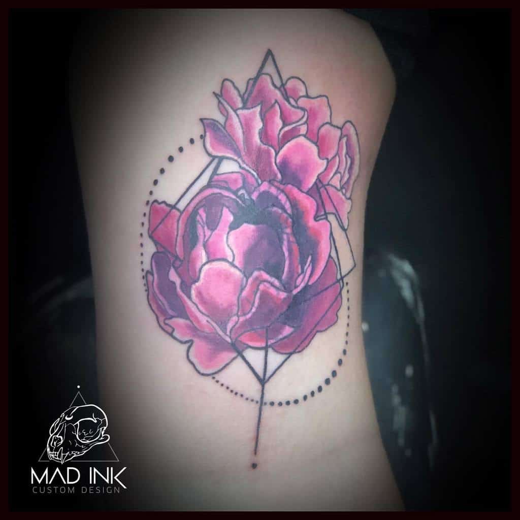 Geometric tattoo design featuring two large, pink roses with a dot pattern