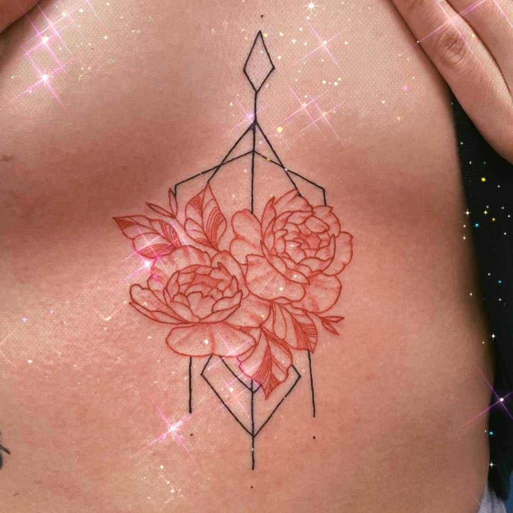 Geometric floral tattoo with pink peonies and sparkling effects on skin