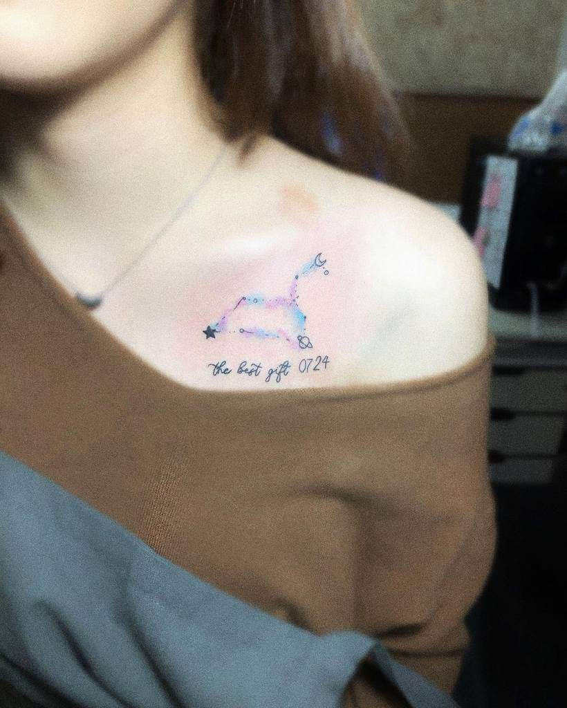 Minimalist Leo constellation tattoo in a delicate watercolor style, symbolizing personal significance and astrology.