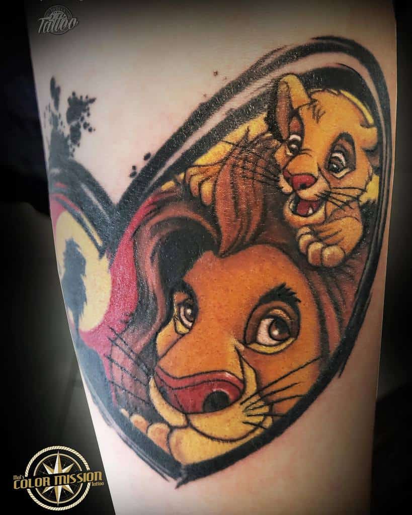 Vivid tattoo featuring Simba and his father Mufasa within a heart-shaped design, showcasing their strong bond and love