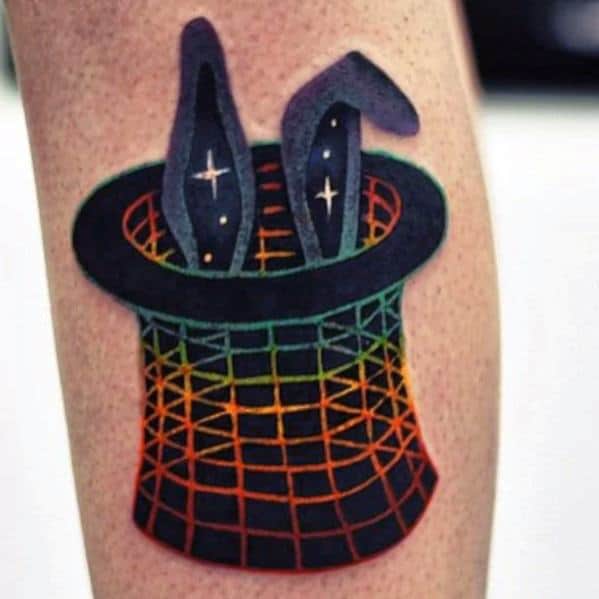 Tattoo of a cosmic hat with rabbit ears in a colorful grid pattern