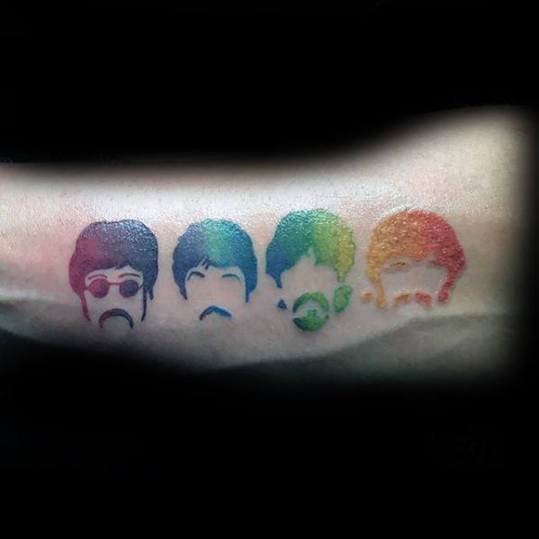 Colorful minimalist tattoo of The Beatles’ faces in rainbow shades, each member distinguished by unique hair, glasses, and mustache silhouettes.