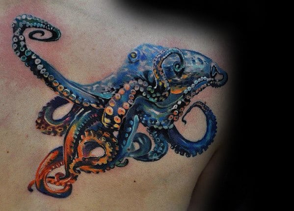 Realistic, colorful octopus tattoo on a person's shoulder against a dark background
