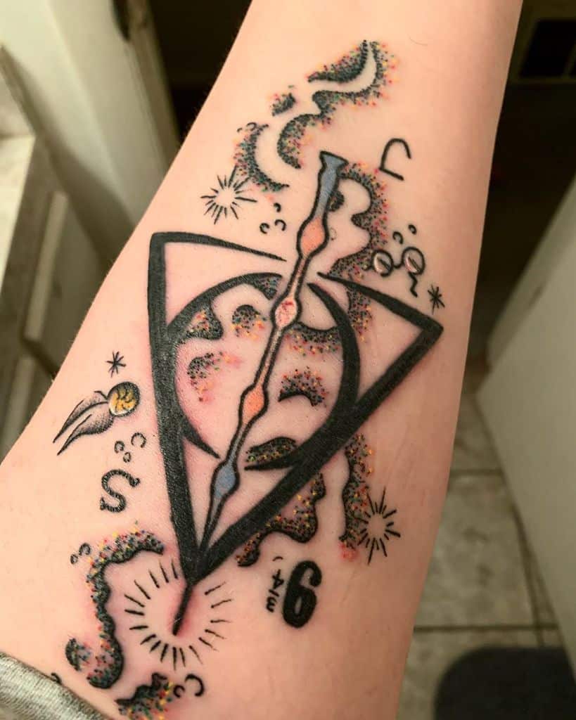 Deathly Hallows tattoo with cosmic elements, magical bursts, and a split wand design, featuring a golden snitch and colorful dotwork.