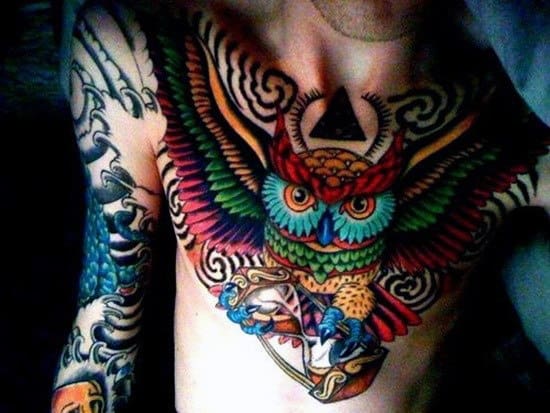 Colorful Owl Flying With Hourglass Male Tattoos