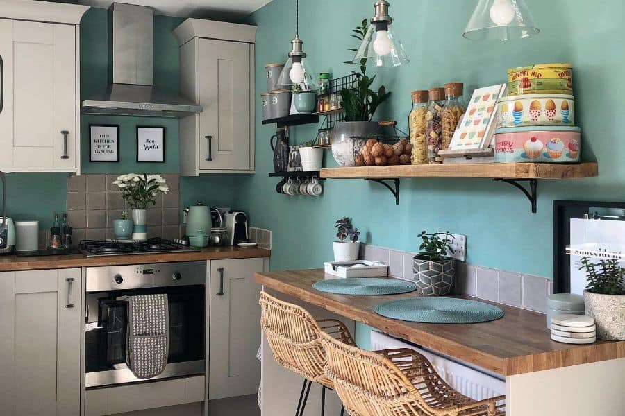 blue wall and gray tile backsplash retro kitchen
