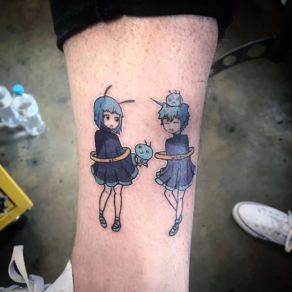 Colorful tattoo of Sorano (Angel) and Yukino Aguria from Fairy Tail, featuring delicate shading, blue tones, and celestial-themed elements.