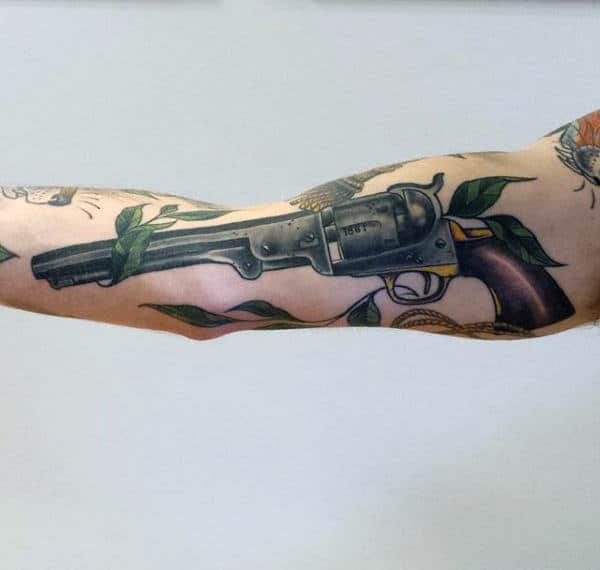 Colt Pistol Tattoo With Leaves On Forearms For Men