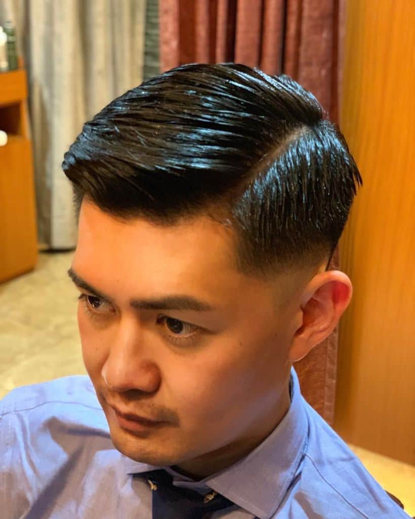 Medium hair comb-over and a clean line cut on one side