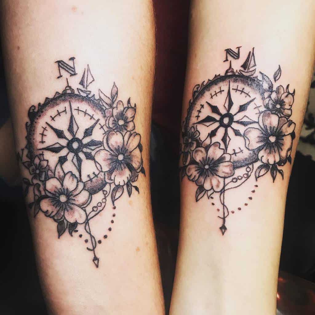 Matching compass mother-daughter tattoos with floral design, featuring detailed line work and shading in black ink