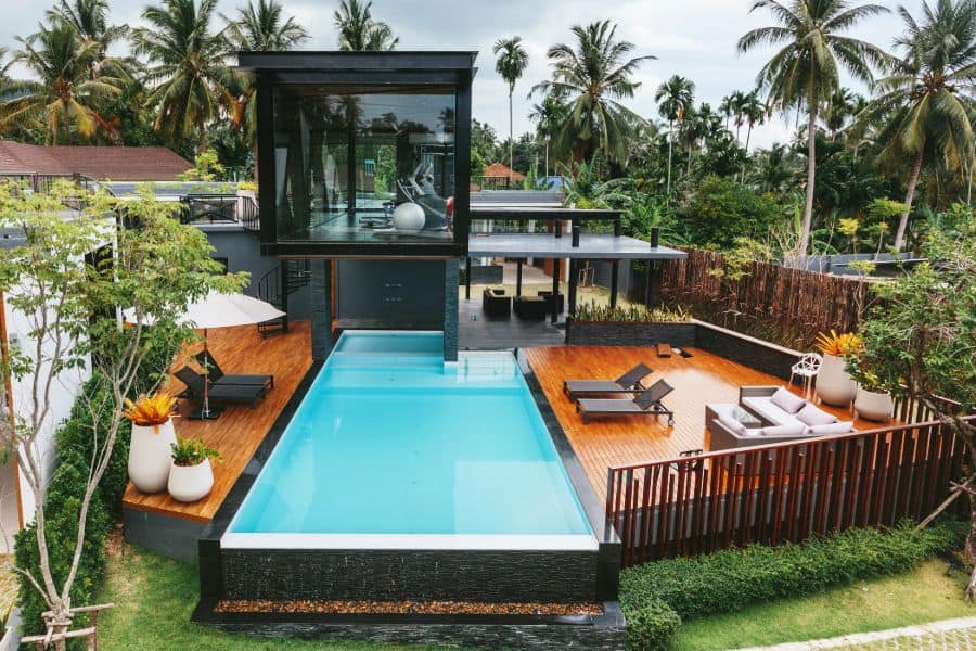 luxury home with wood deck and infinity pool