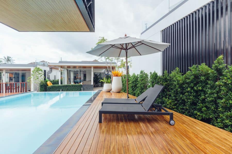 wood deck with sun lounges pool