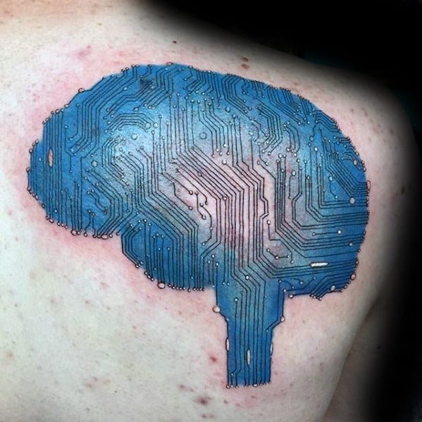 Tattoo of a blue brain-shaped circuit board on the upper back, blending technology with human intelligence symbolism.