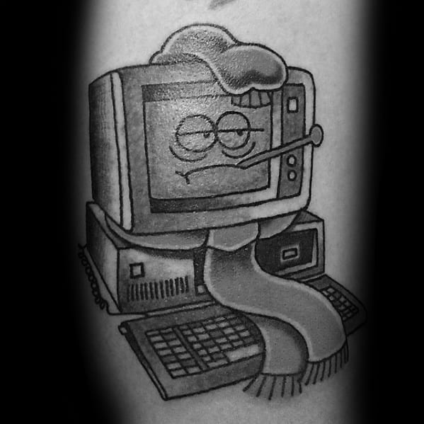 Black and grey tattoo of a sick cartoon computer with a thermometer, hat, and scarf, giving the old machine a humorous personality.