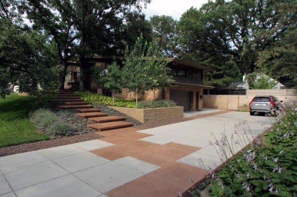 Modern concrete driveway with alternating white and brown panels for a geometric design.