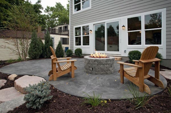 concrete fire pit wood chairs