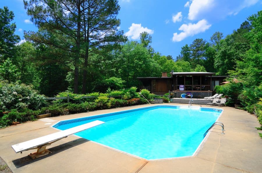 concrete pool deck with diving board