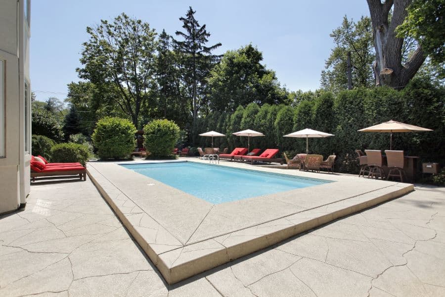 concrete pool deck with seating