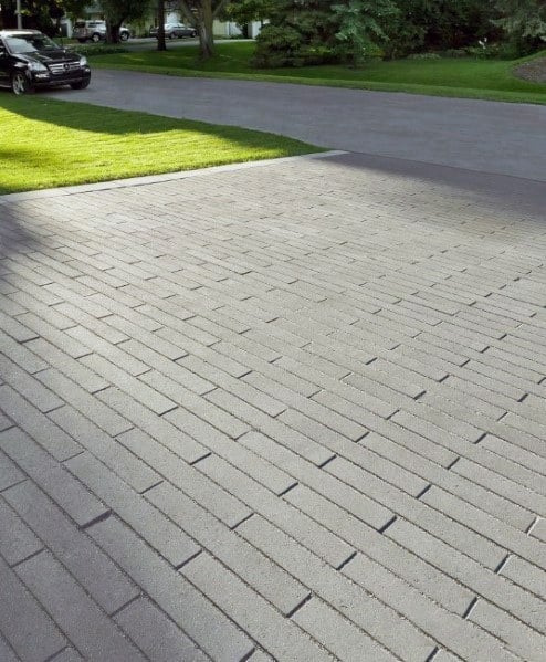 Brick-patterned concrete driveway with a smooth and uniform finish.