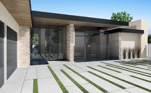 Concrete driveway with parallel grass strips creating a modern linear design.