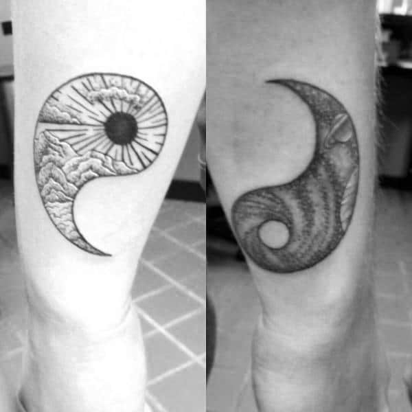 Matching yin-yang tattoos with sun and moon designs, symbolizing balance, harmony, and the complementary nature of the couple.