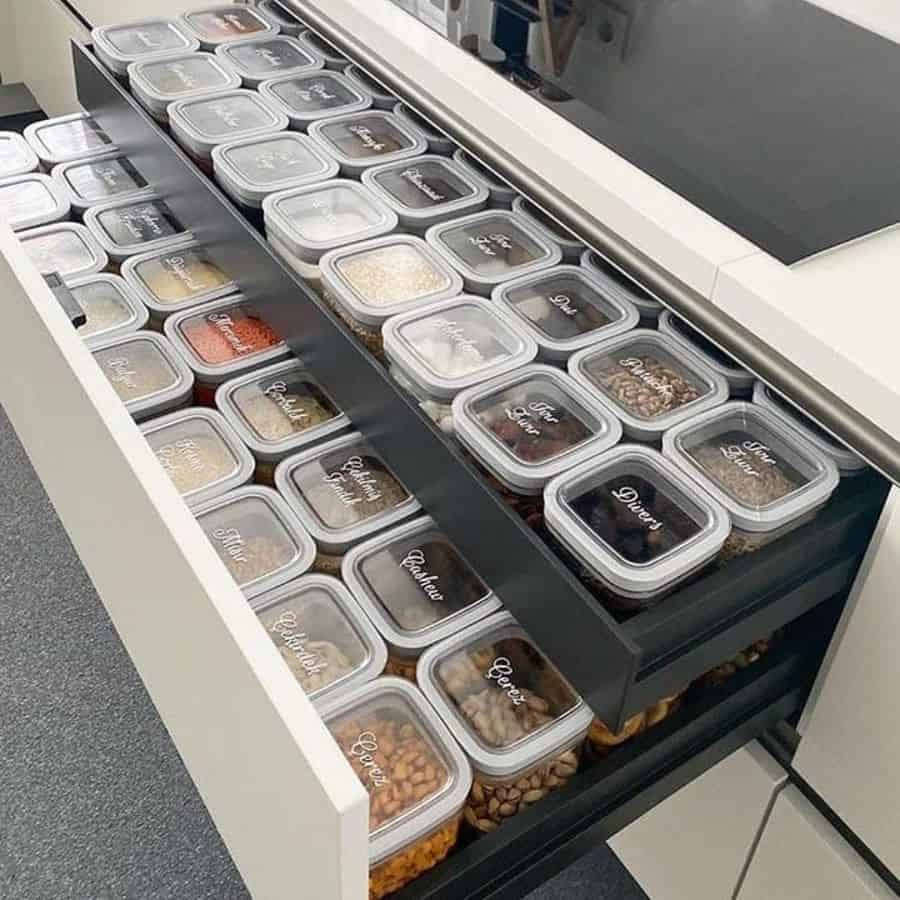 neatly arranged containers in kitchen drawers