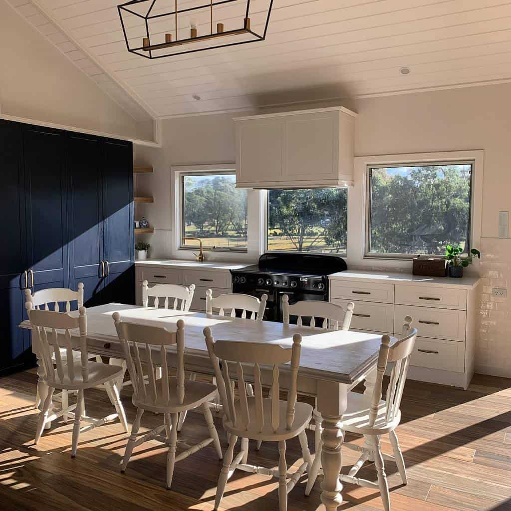 contemporary kitchen and dining room white wood dining table and chairs blue cabinet vinyl flooring