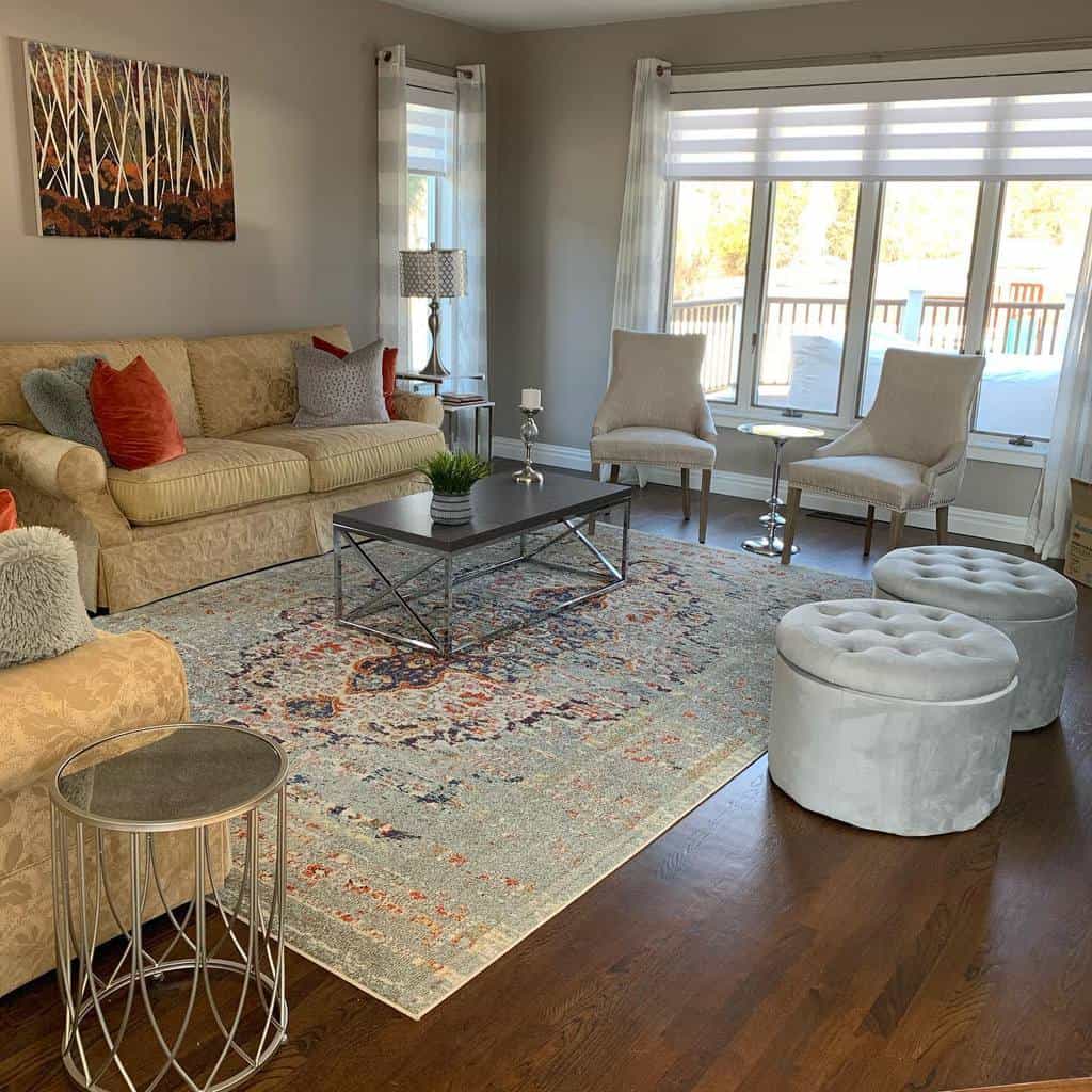 contemporary formal living room vinyl wood flooring sofas and chairs faded floor rug