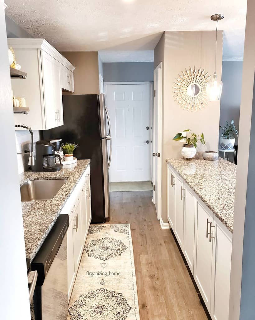 small contemporary galley kitchen granite countertop vinyl wood flooring