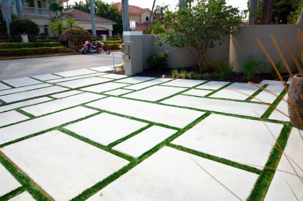 concrete paver driveway with grass joints