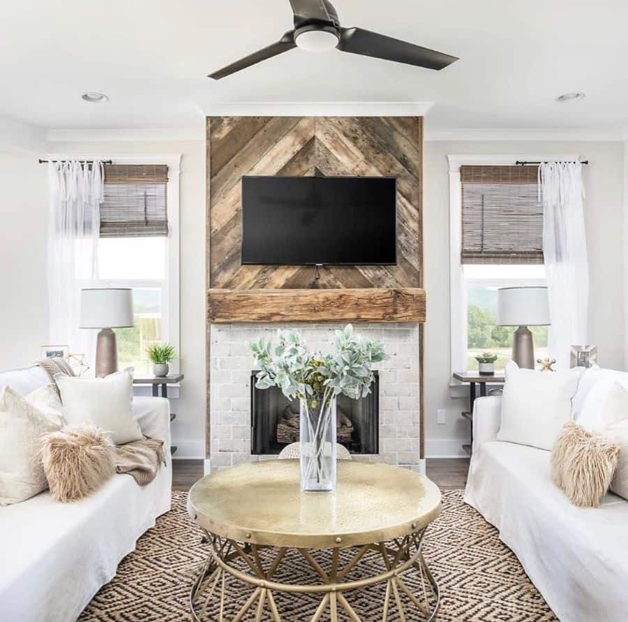 contemporary modern farmhouse living room white sofa gold table stone fireplace wall mounted tv