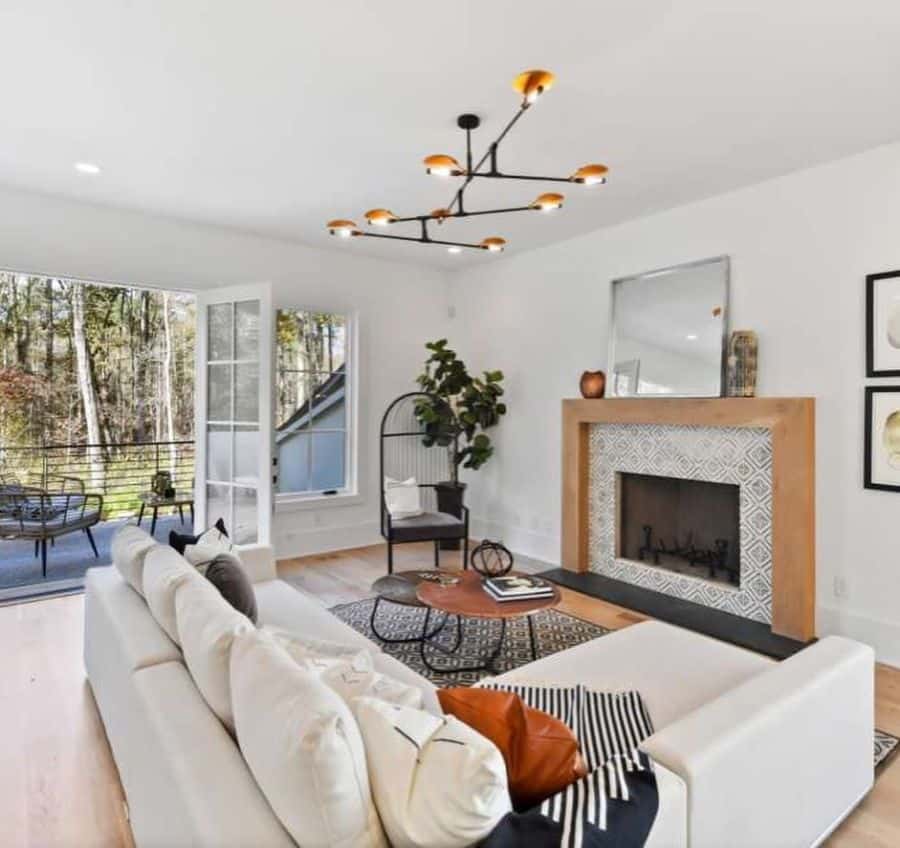 contemporary modern farmhouse living room white l-shape sofa tile fireplace sputnik chandelier balcony