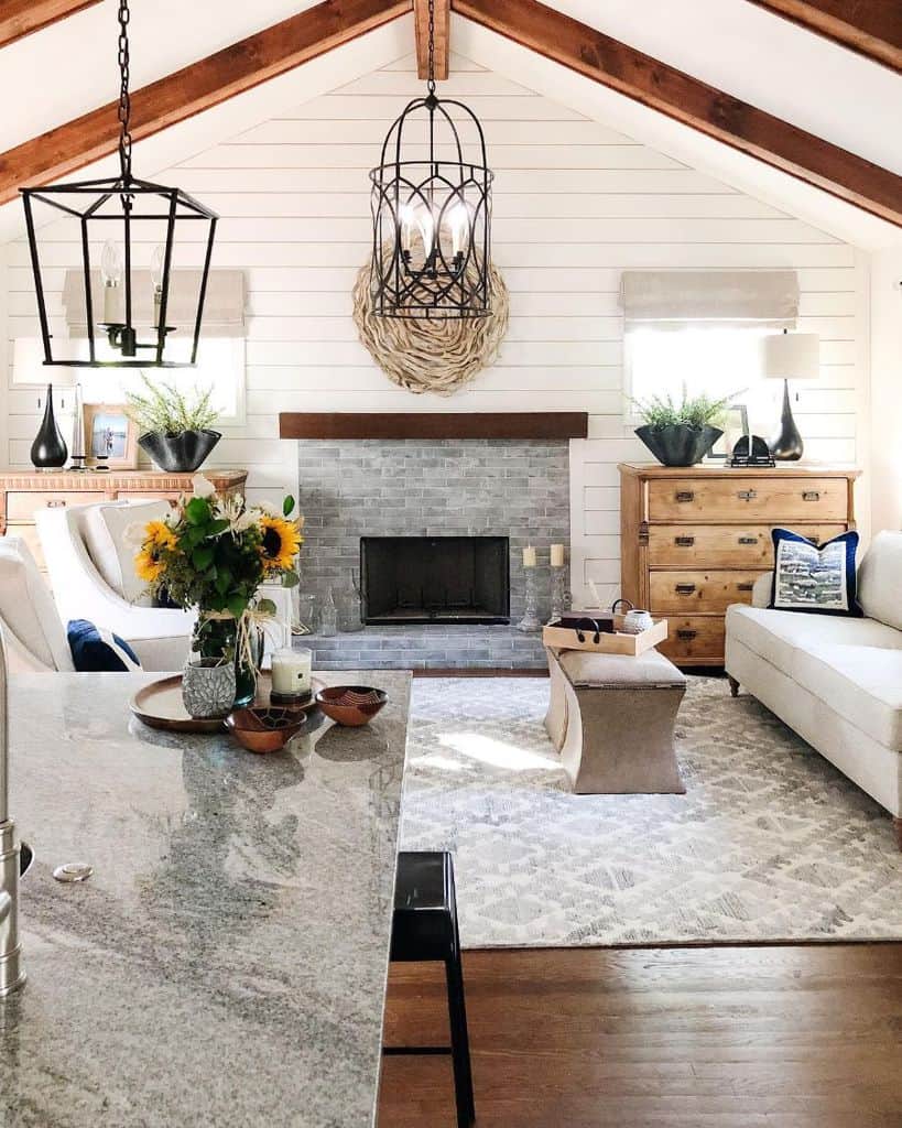 contemporary modern farmhouse living room shiplap wall gray brick fireplace wood cabinet white sofa