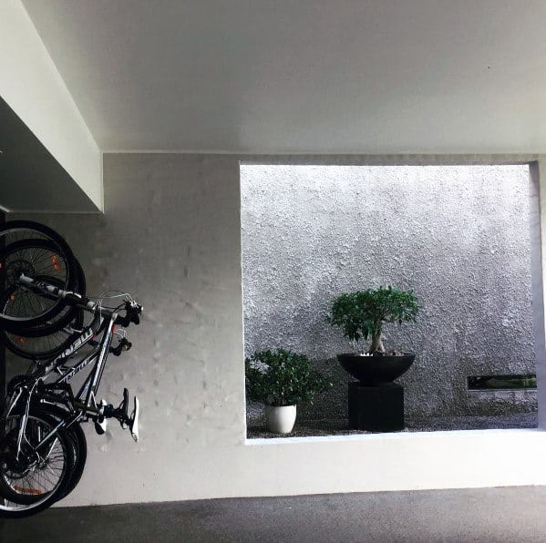 contemporary recessed wall with planter and hanging bikes