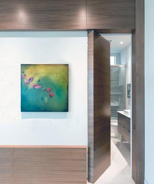contemporary wood panel hidden bathroom door