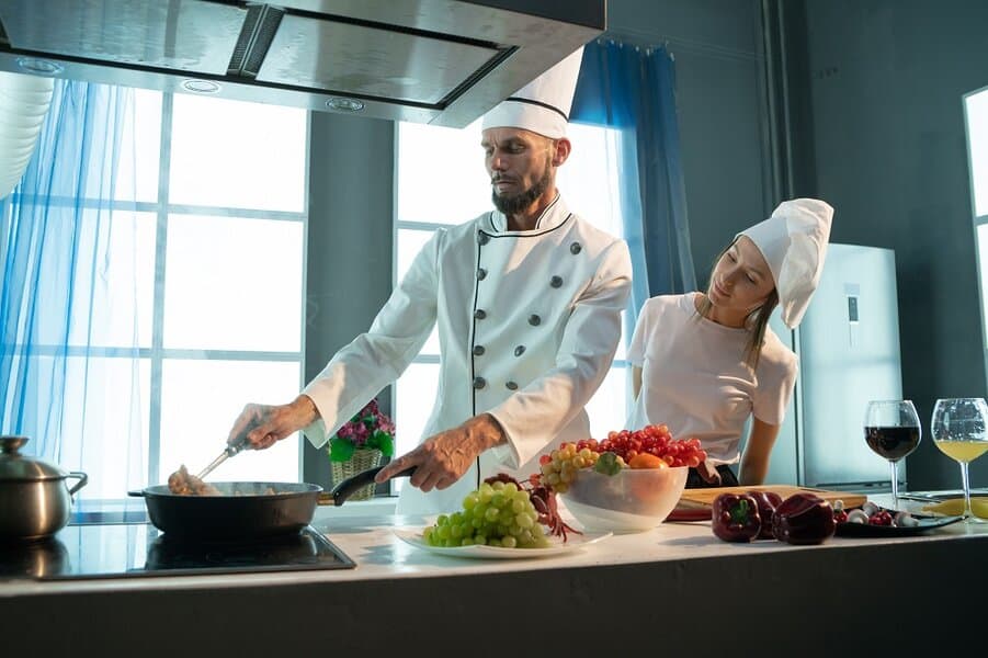 cook teaches the student a culinary