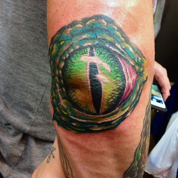 Cool Alligator Eye Tattoo For Men On Elbow