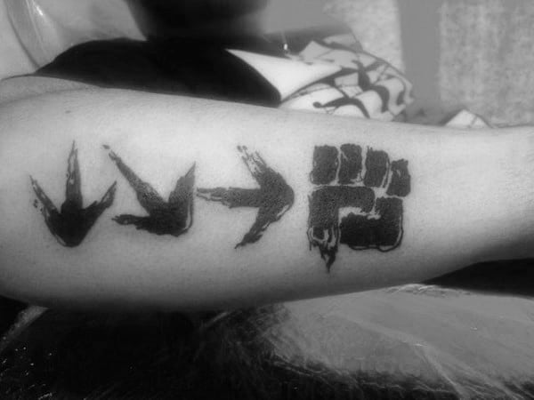 Cool Arrows Symbol Male Street Fighter Outer Forearm Tattoo Design Ideas