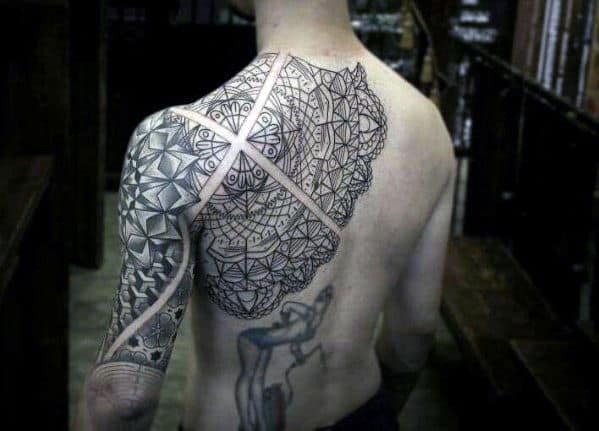 Man with elaborate geometric tattoos on back and shoulder