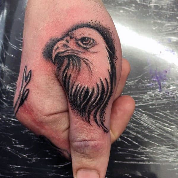 Cool Bald Eagle Thumb Tattoo On Man