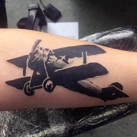 Cool Banksy Plane Tattoo On Arm For Men