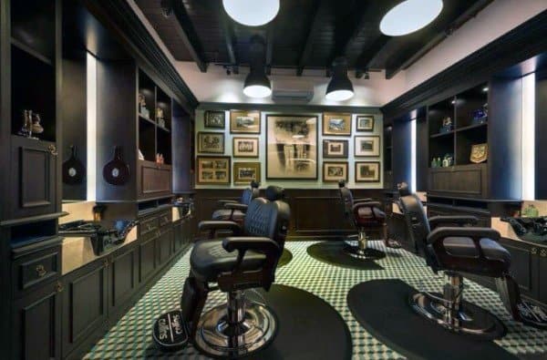 Steampunk-inspired barber shop with vintage decor, leather chairs, and framed wall art.