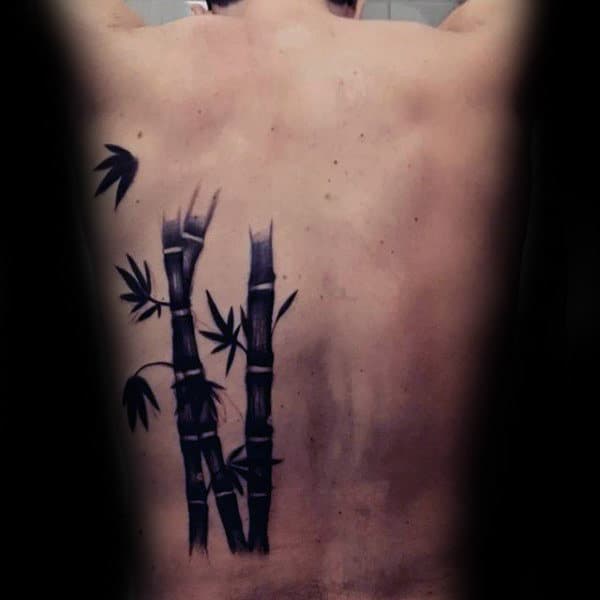 Cool Black Ink Bamboo With Leaves Mens Back Tattoo
