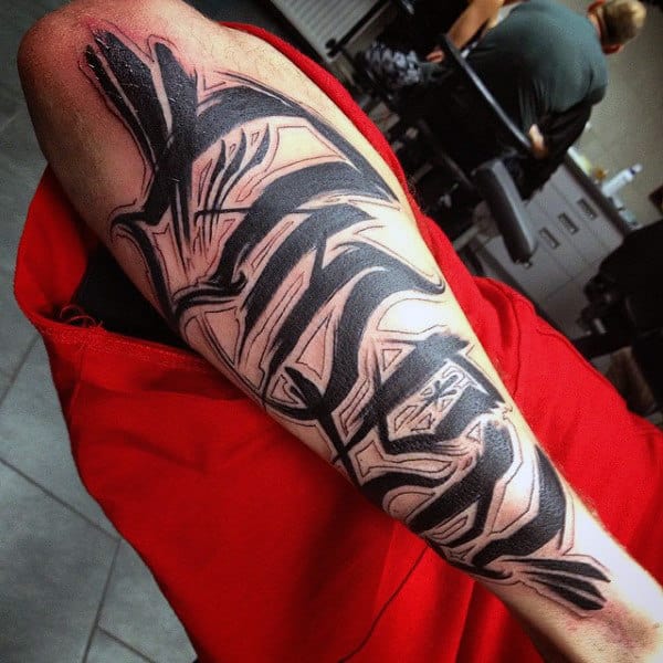 Cool Black Ink Letting Graffiti Tag Forearm Tattoo On Man
