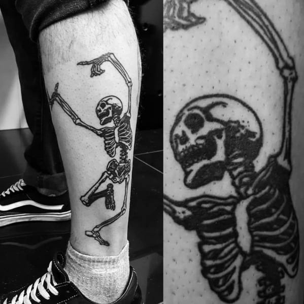 Dynamic skeleton tattoo on the leg, striking a playful dance pose with bold black ink, creating an edgy and expressive look.